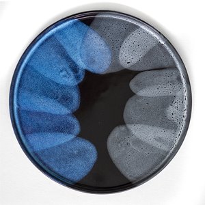 Blue and grey semi circles frame the outside of a black plate